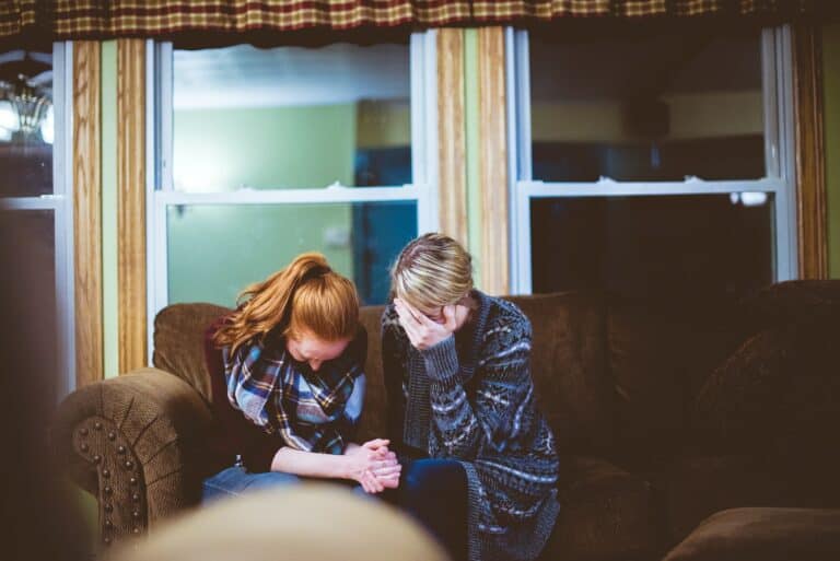 woman praying together